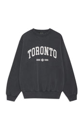 Washed black crewneck sweatshirt with "TORONTO" and "ANIME BING" text printed in white on chest.
