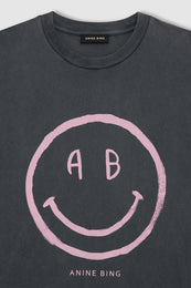 Washed grey crewneck tee with pink smiley face graphic and "AB" text on chest.