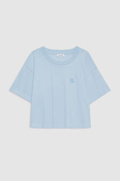 Pale blue cropped t-shirt with small framed monogram embroidery on chest.