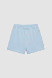 Pale blue shorts with elastic waistband and small monogram logo on thigh.
