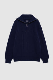 Midnight blue ribbed sweater with a quarter-zip collar and white zipper pull.